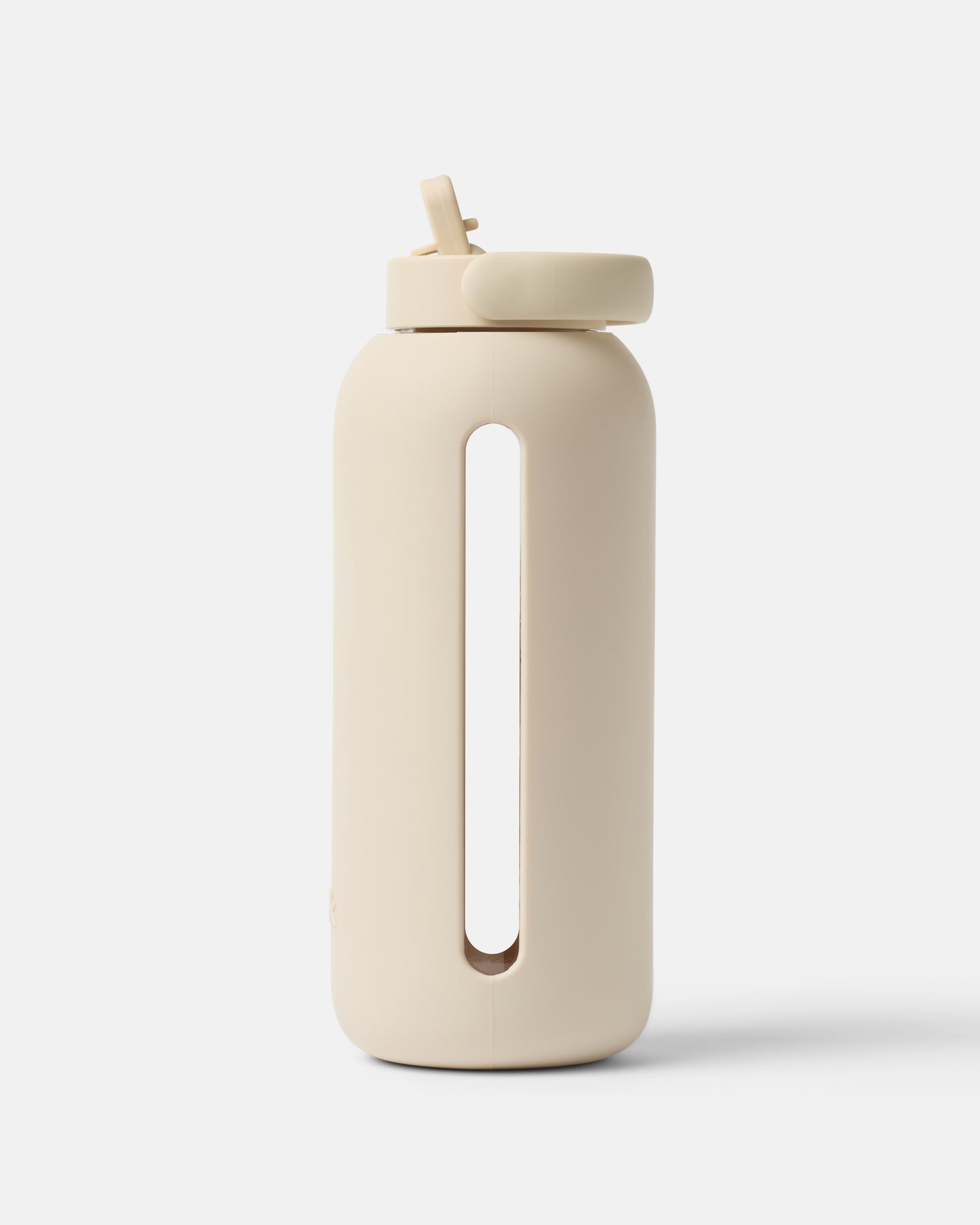 빈크 36oz 빅보틀 스톤 컬러 연한 베이지색 빈크 36oz 빅보틀이 흰 배경 위에 세워져 있다. 몸통 중앙에 세로로 긴 타원형 손잡이 겸용 홈이 뚫려 있고 뚜껑에는 빨대 캡이 달려 있다